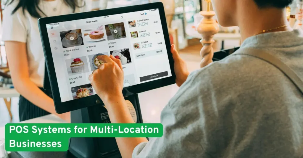 Person using a modern POS system at a counter, showcasing technology solutions designed for multi-location businesses.