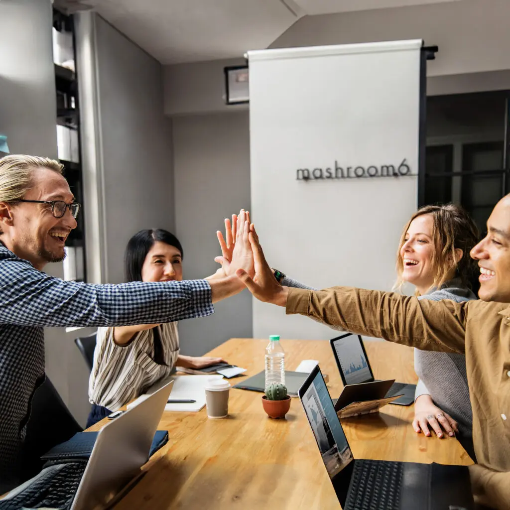 Team celebrating successful business integration using UsPayRun POS and payroll solutions